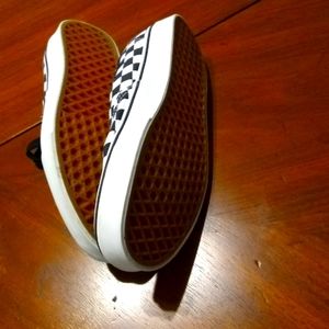 Women's black and white checkered Vans sneakers